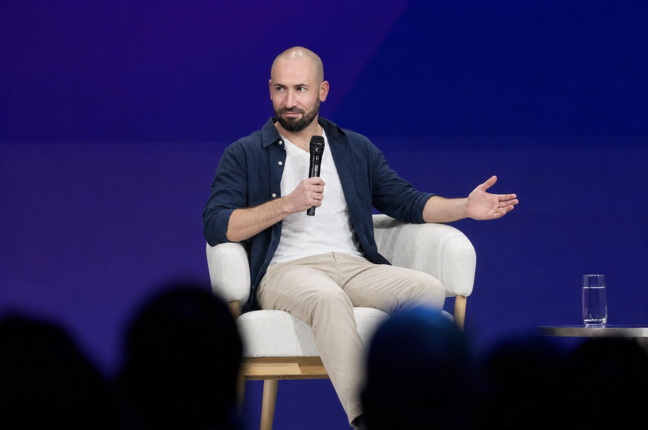 Jonathan Kuzmanko speaking at an AI industry event